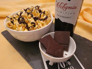 Chocolate-drizzled popcorn paired with Primitivo (or red Zinfandel)